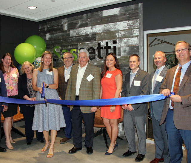 Group Cutting A Ribbon