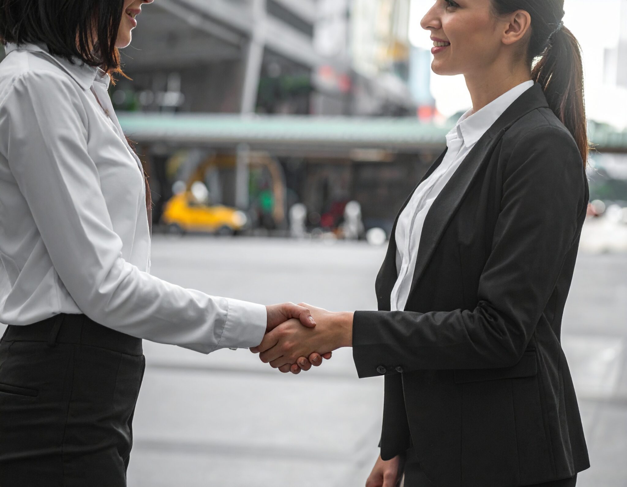 Firefly Two Sec Women In Suits Shaking Hands Near Weallstreet 759997